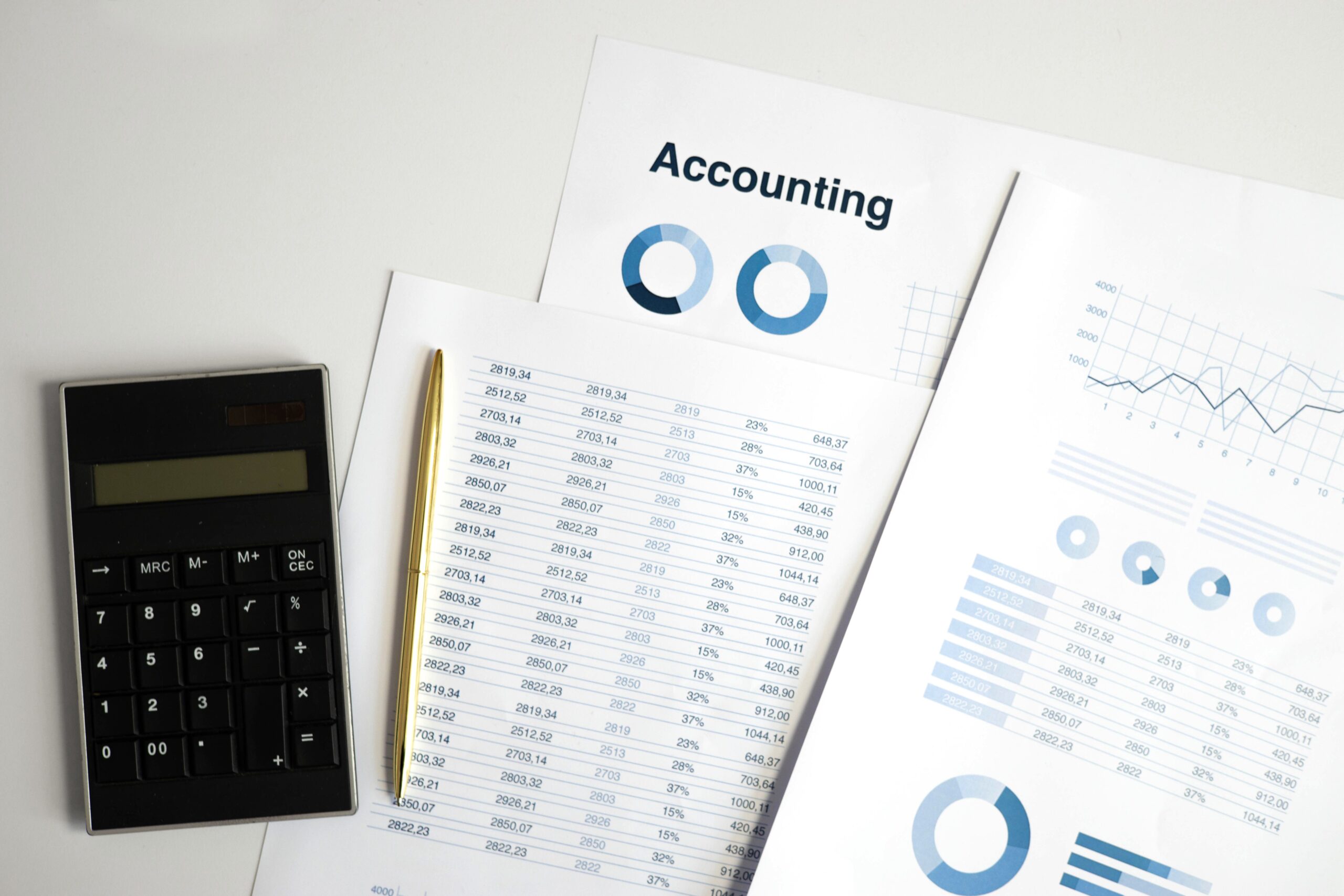 Professionals reviewing dashboards or financial data